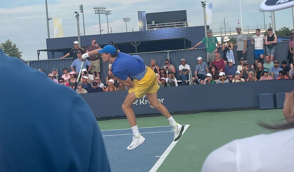 Jannik Sinner practicing his serve