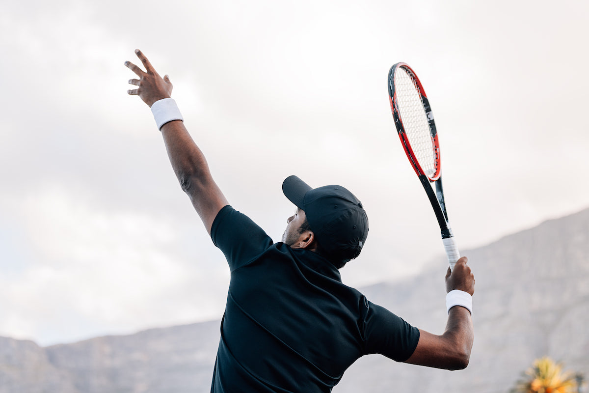 Tennis Player hitting a serve