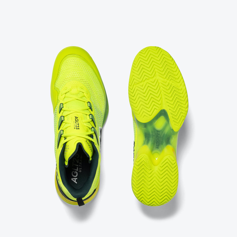 Breathable, lightweight Lacoste AG-LT23 Men's Tennis Shoes in vibrant yellow, offering optimal comfort and agility