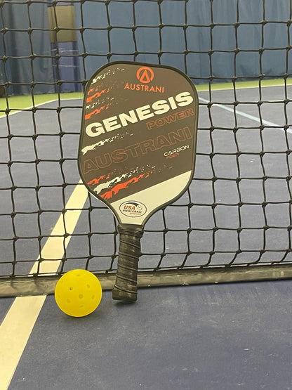 Austrani Genesis Power Pickleball Paddle and a pickleball at the net